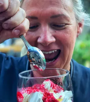 a woman with a mouthwatering dessert at weirs bar & restaurant multyfarnham